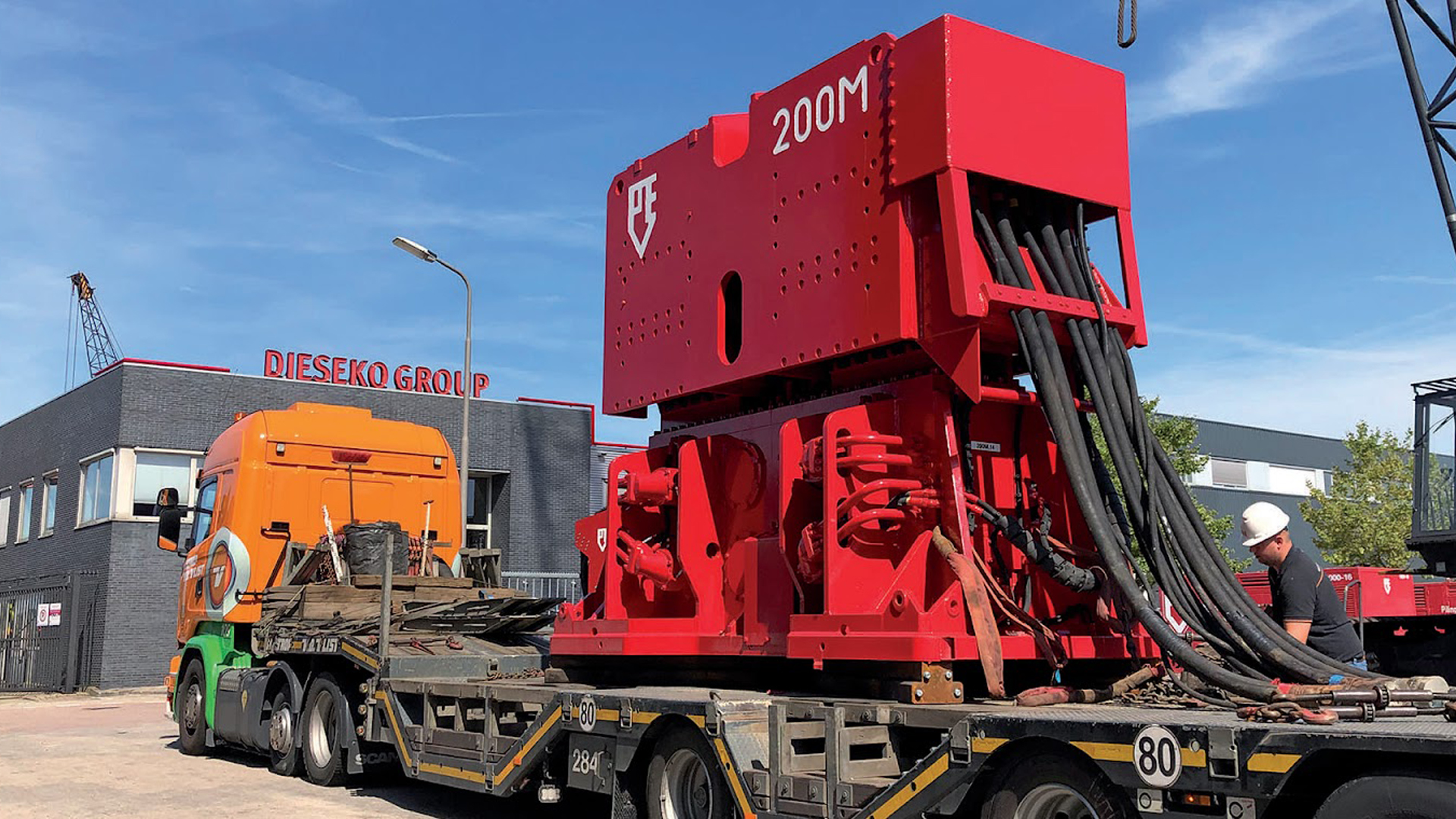 A piece of Dieseko Group Innovative equipment sits on a flatbed truck awaiting delivery.
