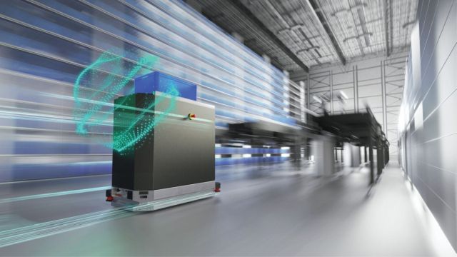 Picture of a robot working as part of an Intralogistics system inside of a manufacturing plant