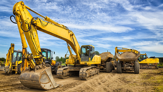 Heavy equipment machines in an outdoor environment