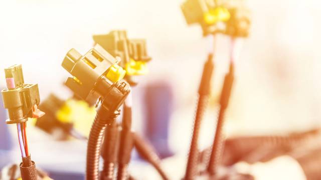 Image of a wiring harness on an assembly line in a wire harness manufacturing facility