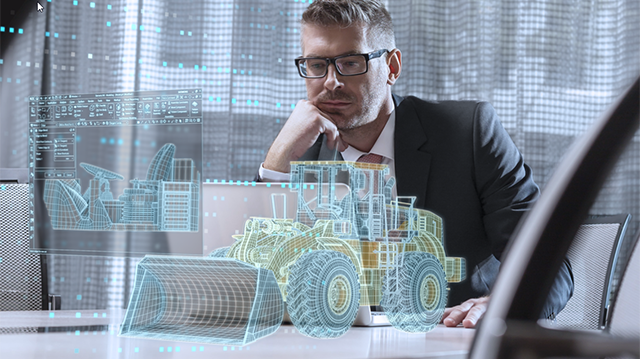 Man working with digitized heavy equipment design tool software