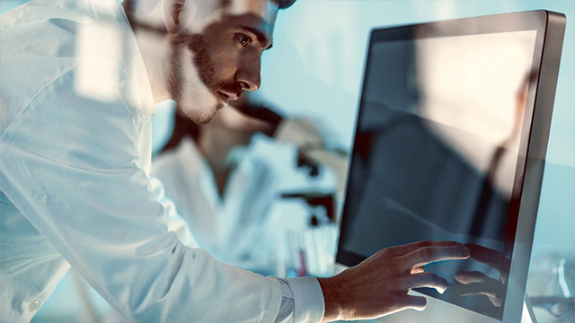 Man viewing computer screen for product performance analysis