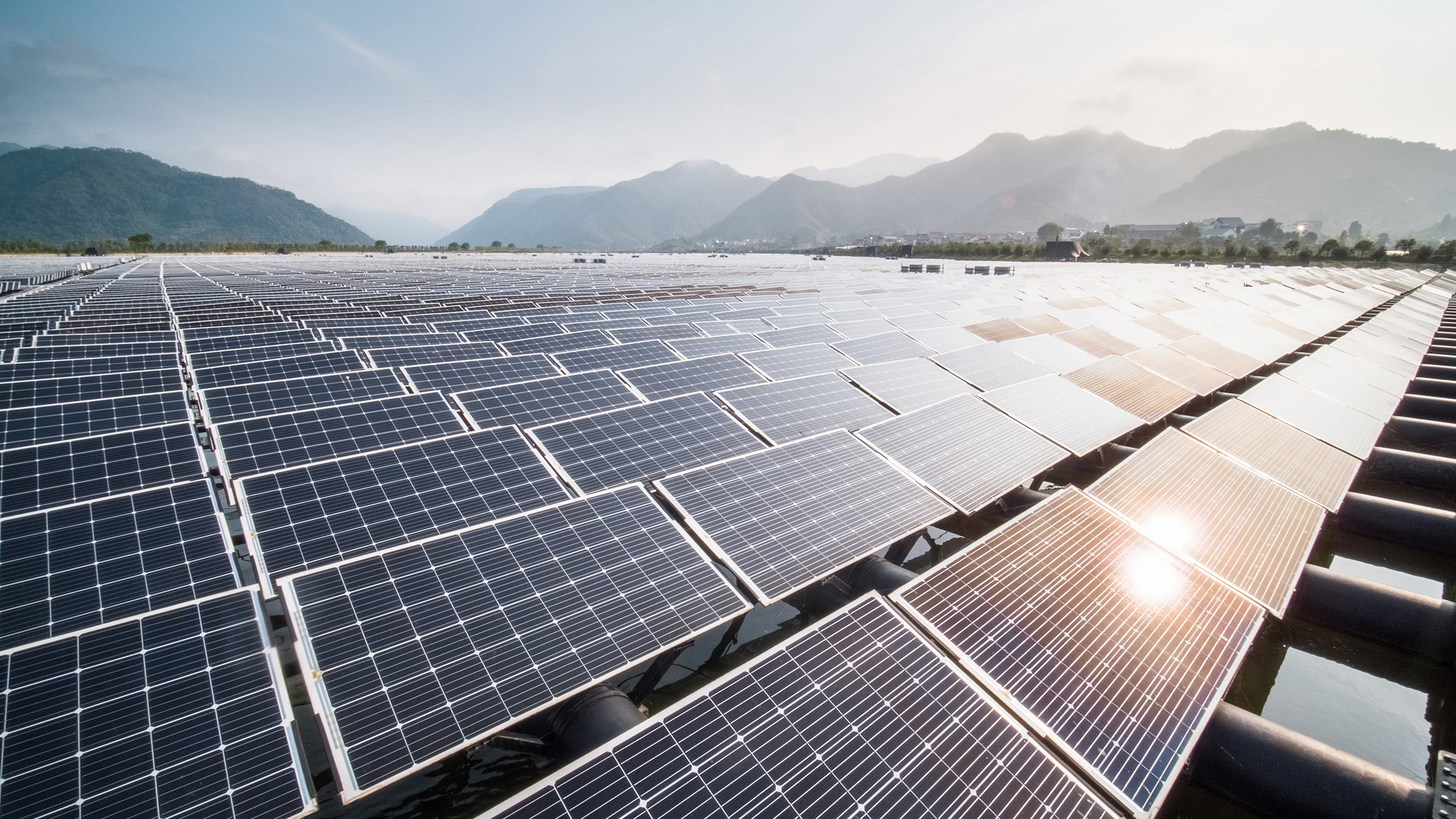 Solar farm surrounded by mountains