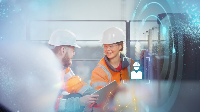Manufacturing engineers leverage manufacturing process planning. Two manufacturing engineers happily working together on a large part and supported by manufacturing process planning.