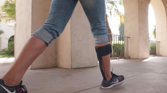 Woman walking with Elevate leg brace