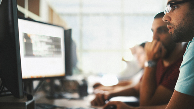person scrolling on a computer with graphic overlay