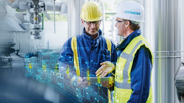 Two chemical industry manufacturing workers on a production floor with a digital overlay
