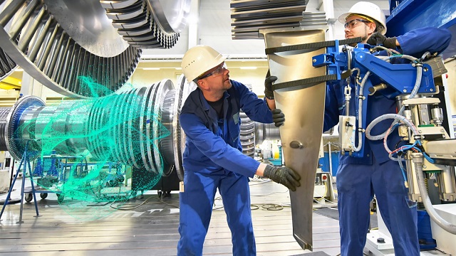 Gas turbine construction workers with simulation in the background