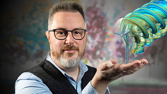 Man holding a digital image of a wind turbine in his hand