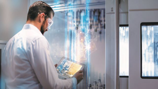 Man in medical lab looking at computer