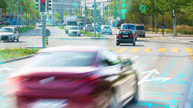 Car driving on street. Image displays a digital layer.