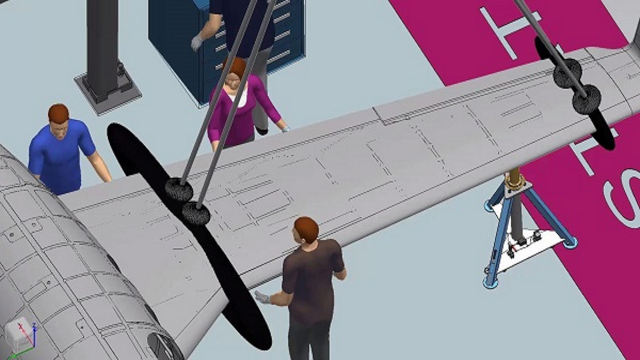 Aircraft Manufacturing Engineering Process of a man and a woman adjusting an aircraft wing